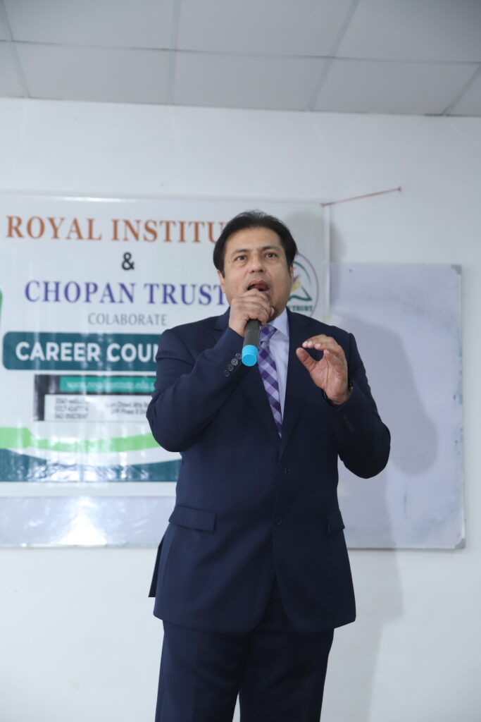 Chairman of the Royal Institute, Dr. Kamran Haq, giving a speech about career counseling and course offerings.